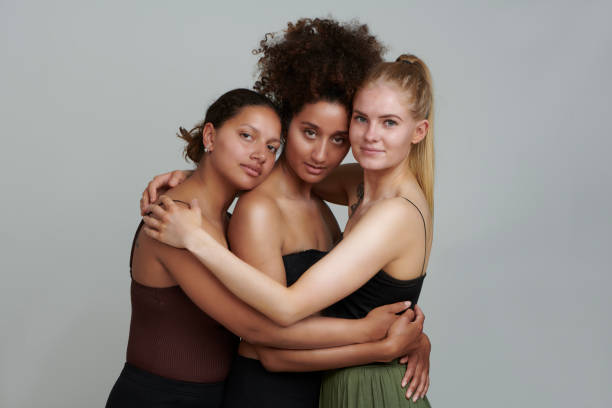 istock Three girls embracing each other 1160183133