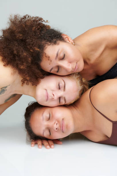 istock Three girls with heads on each other 1160183140
