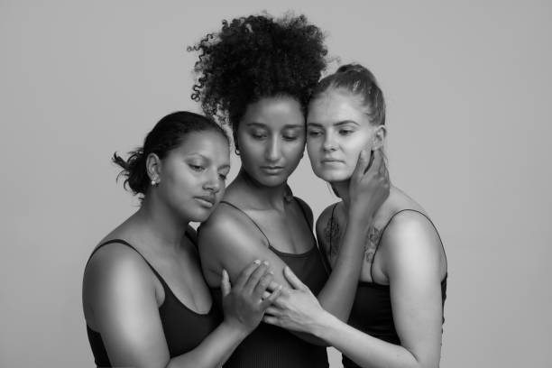 istock Three girls embracing each other 1160183150
