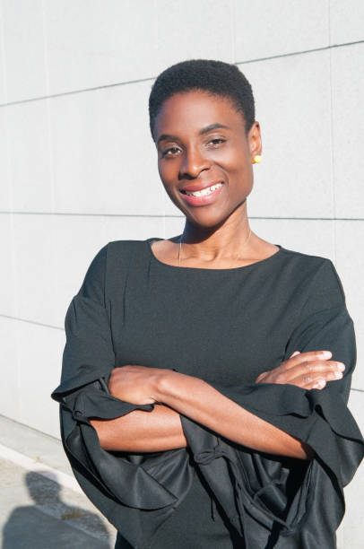 istock Smiling black woman posing at camera outdoors 1160186317