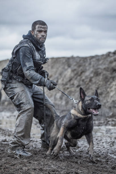 istock Military Mud Run individual with a working dog 1160187567