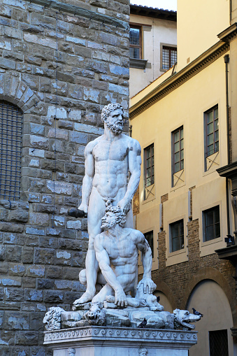 FLORENCE, ITALY - AUGUST 27, 2018: Hercules and Cacus statue from Giambologna in front of the Palazzo Vecchio on the Piazza della Signoria im historic center of Florence - Italy.