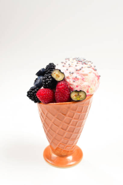 istock Ice cream with blueberries, blackberries and raspberries on a white background.  Copy space. 1160187885