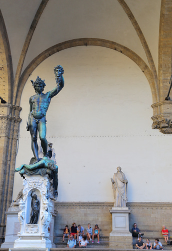 FLORENCE, ITALY - AUGUST 27, 2018: Perseus with the Head of Medusa Statue, Loggia dei Lanzi near Palazzo Vecchio building palace, Florence, Italy