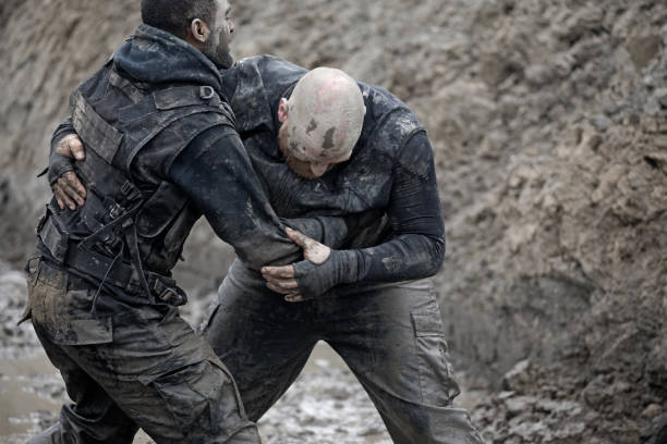 istock Krav Maga military muddy fighting duo 1160188531