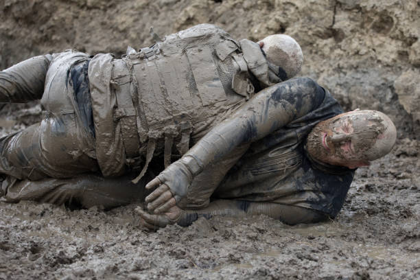 istock Krav Maga military muddy fighting duo 1160188593