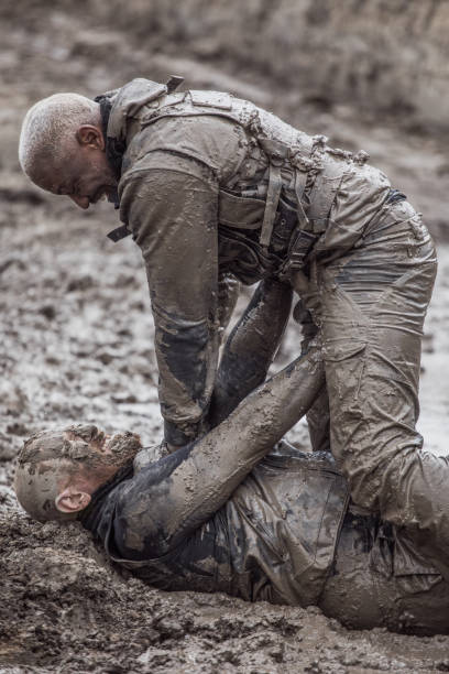 istock Krav Maga military muddy fighting duo 1160188721