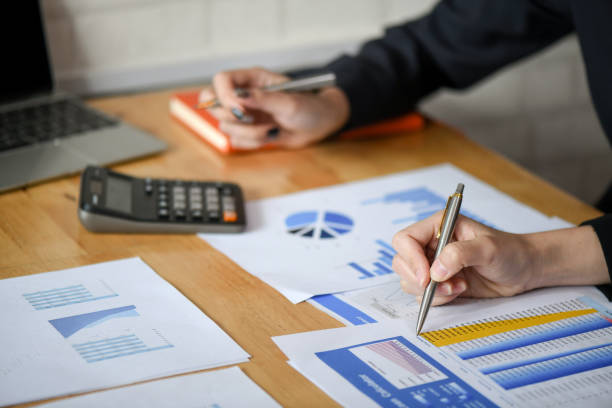 istock The female staff team is analyzing the graph in the office. 1160188727