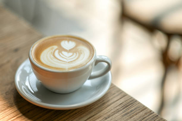 istock Coffee heart shape o n wood table in cafe.close-up shoot. 1160188901