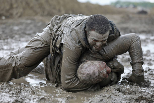 istock Krav Maga military muddy fighting duo 1160188947