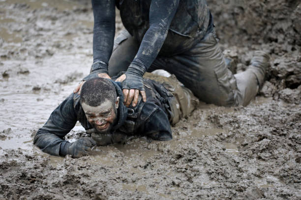 istock Krav Maga military muddy fighting duo 1160188948