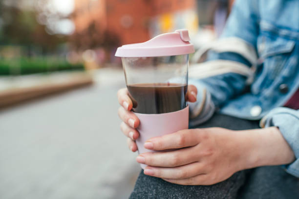 istock Young woman with eco-friendly reusable coffee cup and cotton bag, zero waste concept 1160189090