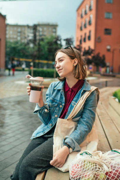 istock Young woman with eco-friendly reusable coffee cup and cotton bag, zero waste concept 1160189128