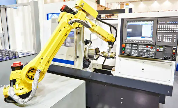 Photo of Robotic arm and cnc lathe
