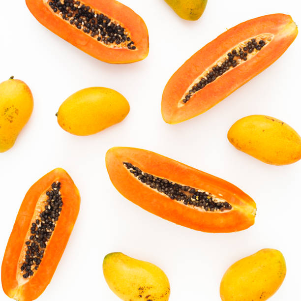 istock Fruits pattern with sweet papaya and mango fruits on white background. Flat lay. Top view. Tropical fruit concept 1160191102