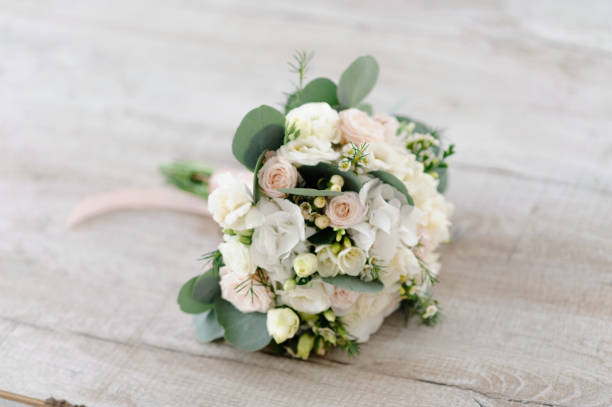 istock Wedding bouquet on the wooden floor 1160191609