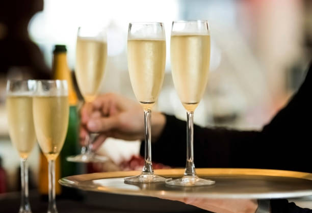istock Waitress serving champagne on the tray at the store 1160192075