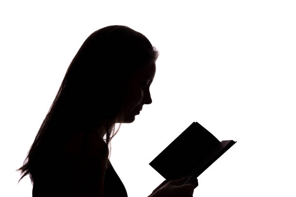 Girl read a book - silhouette, isolate