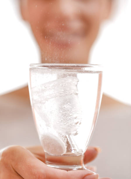 istock Young woman using Sterilising effervescent tablets to clean a Menstrual Cup 1160193073
