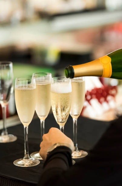 istock Waitress pouring champagne inside the glasses 1160193226