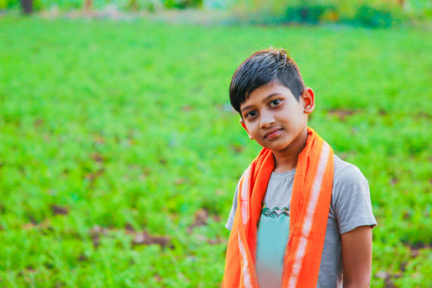 istock cute indian child at farm 1160193378