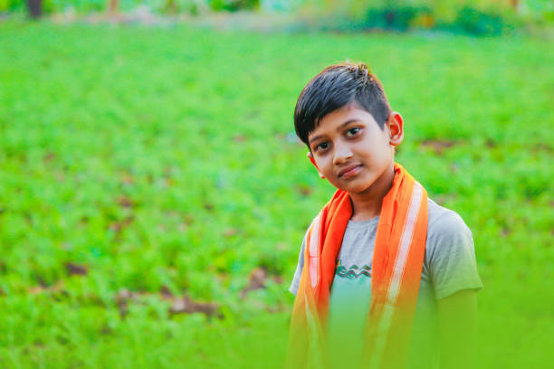istock cute indian child at farm 1160193393