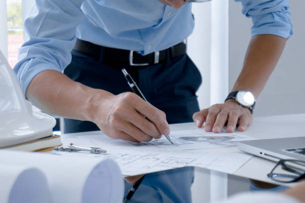 istock Colleagues interior designer Corporate Achievement Planning Design on blueprint Teamwork Concept with compasse. 1160193642