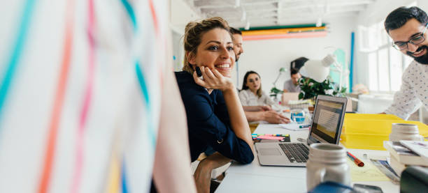 Smiling young woman in the office