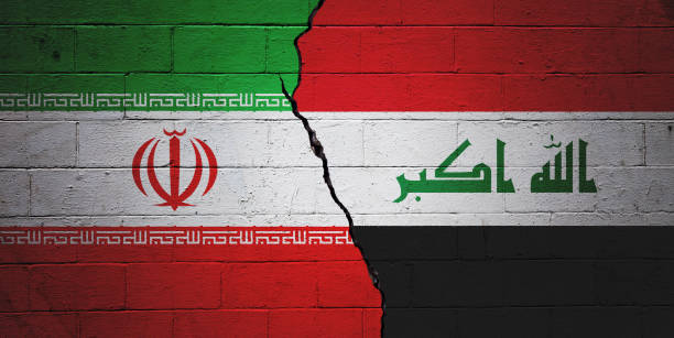 Iran vs Iraq Cracked brick wall painted with a Iranian flag on the left and a Iraqi flag on the right. iraqi flag stock pictures, royalty-free photos & images