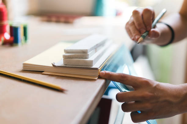 istock Young adult woman making a notebook 1160196357
