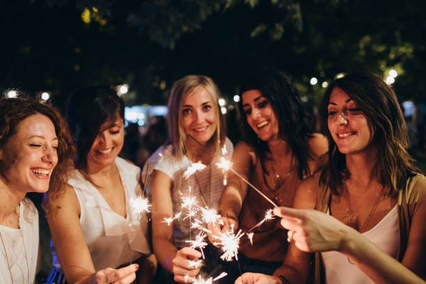 istock Friends having fun together with sparklers 1160197386