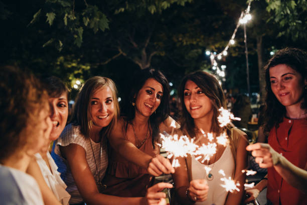 istock Friends having fun together with sparklers 1160197392