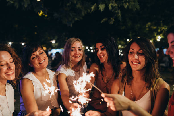istock Friends having fun together with sparklers 1160197405