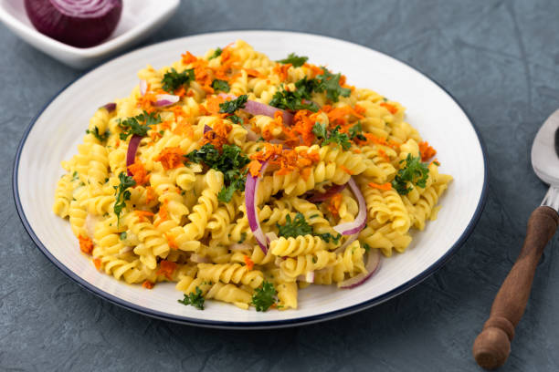 istock pasta fusilli with vegetable in Herb sauce 1160200420