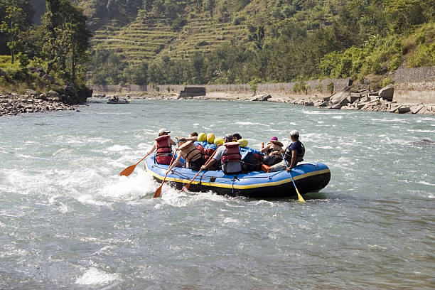 Group of people whitewater rafting in Nepal stock photo