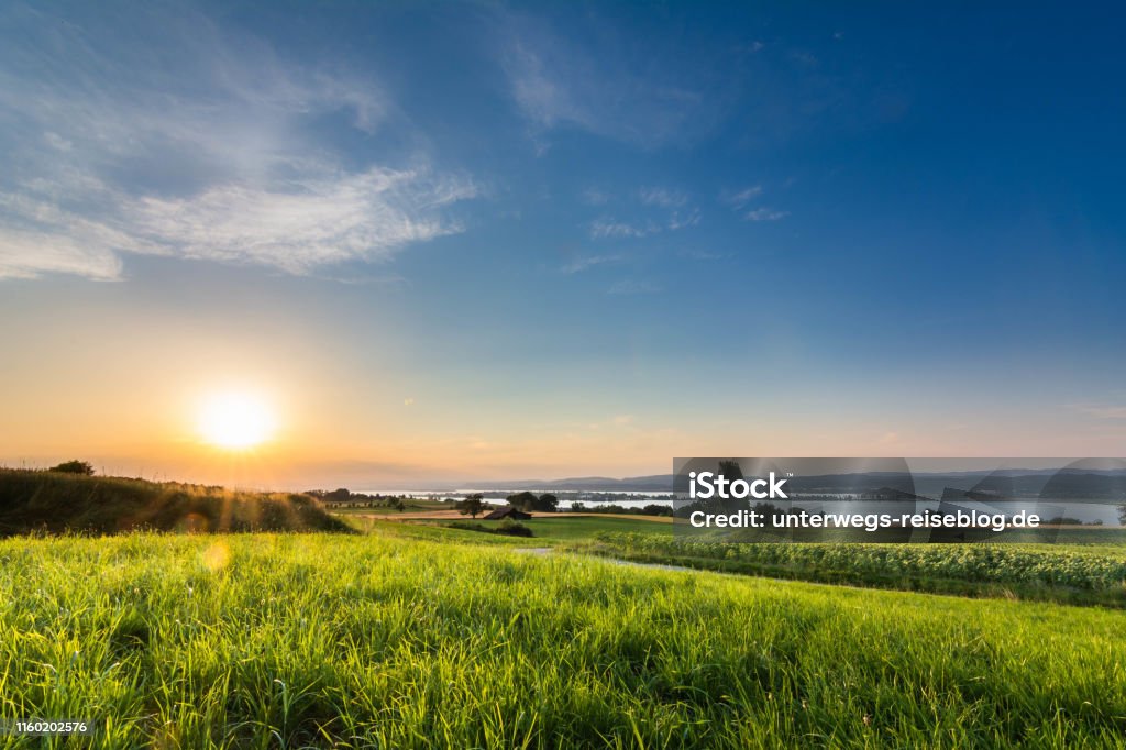 Lake Constance with sunset and sun rays Lake Constance with sunset and sun rays from the shore of Switzerland in summer Bodensee Stock Photo