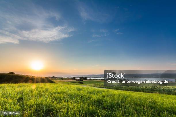 Lake Constance With Sunset And Sun Rays Stock Photo - Download Image Now - Bodensee, Agricultural Field, Agriculture