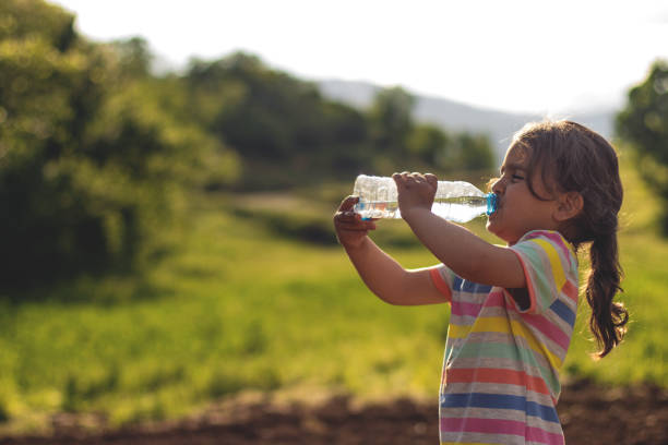 istock A child  drinking water from a bottle 1160203160