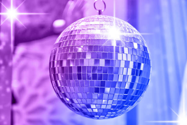 istock Disco ball with bright rays of lights, party background 1160204165