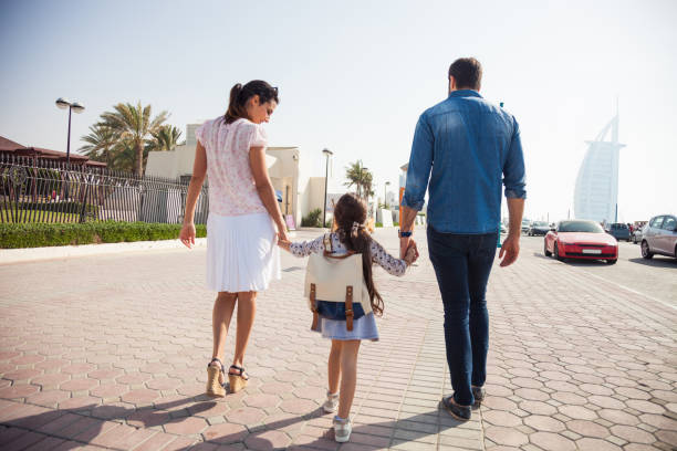 istock Young middle eastern family taking daughter to school 1160207036