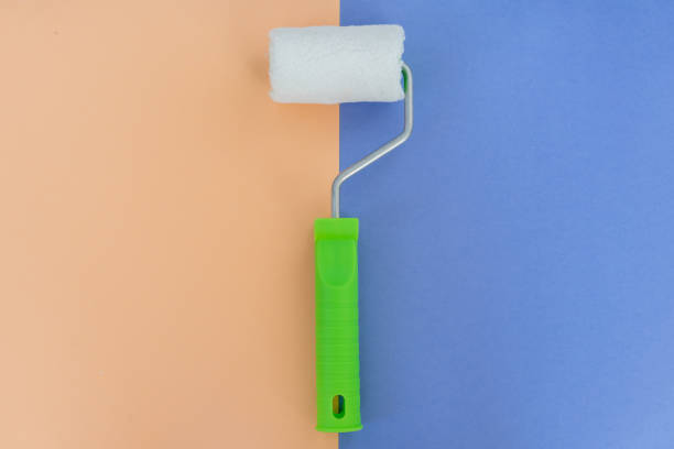 istock Painting roller on colorful background. Preparation for repair 1160207744