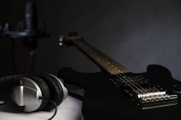 istock Electric guitar, Studio microphone and headphones 1160207768