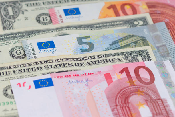 many different american dollars and european union euro banknotes close-up shot - currency exchange currency european union currency dollar imagens e fotografias de stock