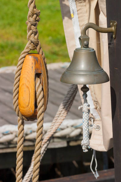 Wooden block and a ship's bell on a boat