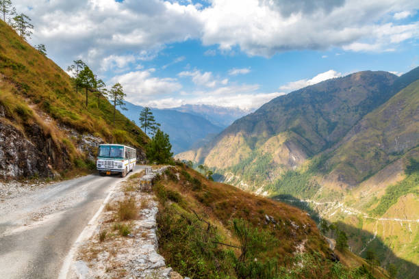 Tourist bus on scenic Himalaya mountain road at Uttarakhand India stock photo