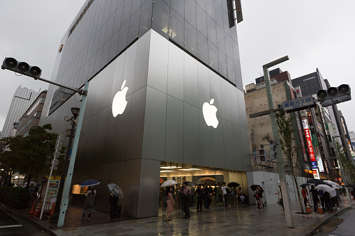 Tokyo, Japan - September 29, 2018 : People walk past the Apple Store in Ginza, Tokyo, Japan. Apple Store Ginza is Apple's 73rd retail store, and it is the first store outside the U.S.