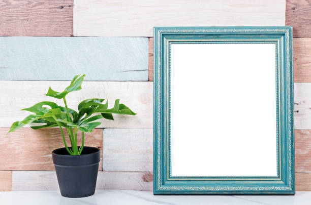 istock Blank vintage photo frame on wooden wall 1160213154