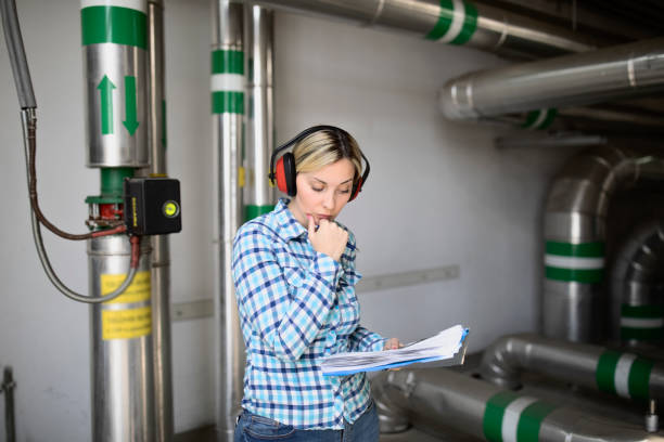 istock Young Female Technician is Checking Heating System in Boiler Room 1160213529