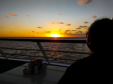 watching the sunset at sea