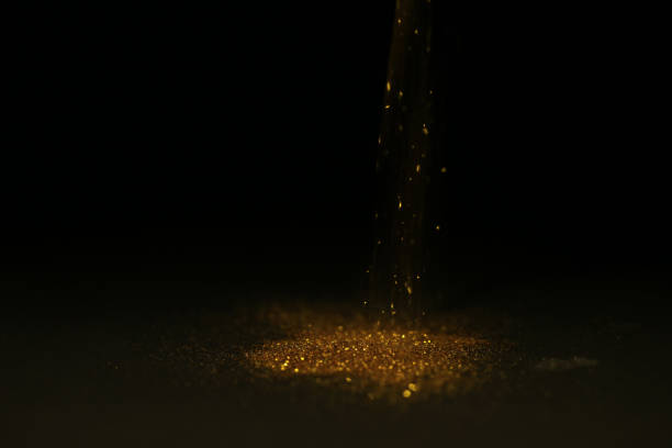 istock Abstract background of Sprinkle gold dust with glitter lights on black background 1160215792
